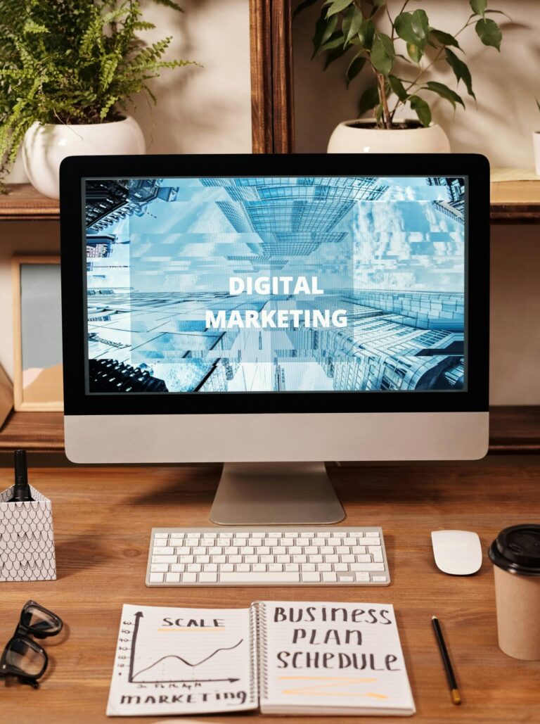 Contemporary office setup featuring digital marketing strategy on a computer screen, ideal for business technology themes.